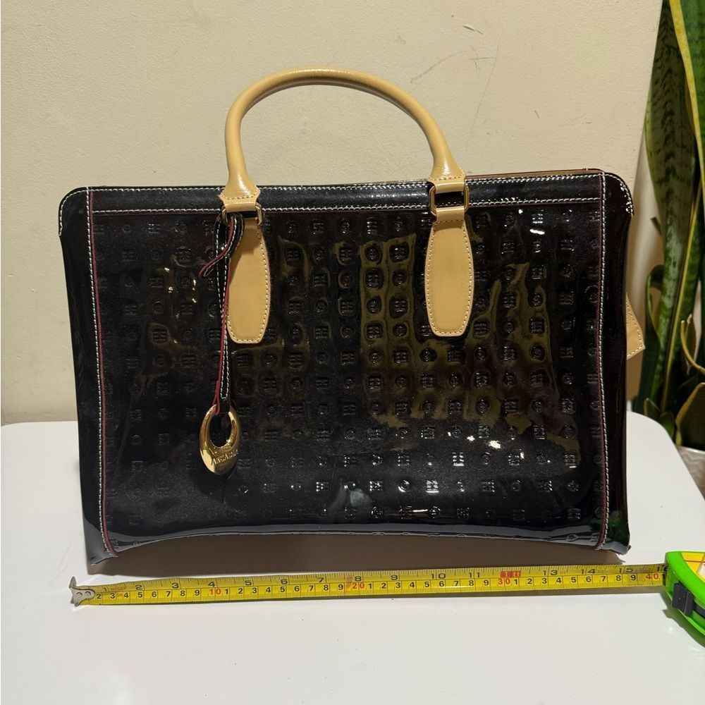 Arcadia Black Patent
Leather Crossbody Straps and goldtone tag Black Tote